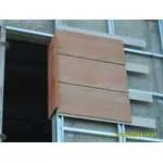Wood-patterned facade cladding.
