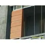 Wood-patterned facade cladding.