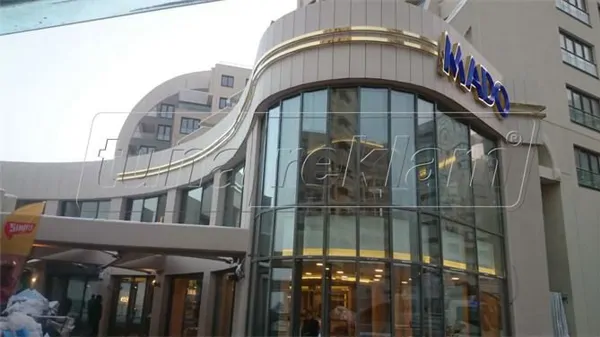 GOLD STAINLESS CHROMNICKEL BOX LETTER AND RIBBON APPLICATION
