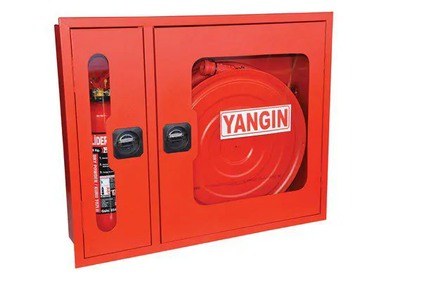 Flush-mounted fire cabinet with tube compartments and glass door.